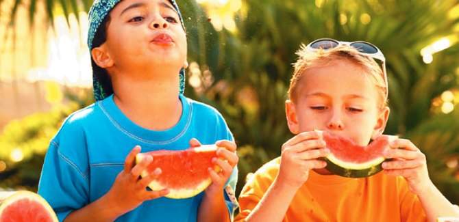 boys spitting watermelon seeds